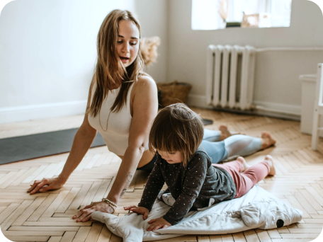 Mother and her child exercising together